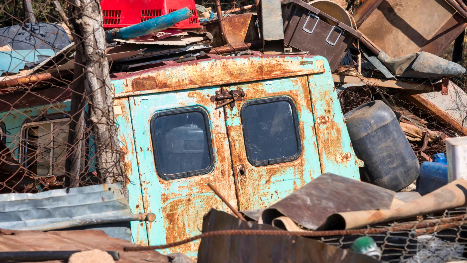 pile of junk and old van on a dumpster san juan capistrano ca